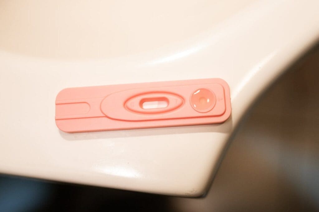 pregnancy test laying on the bathroom sink